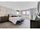 Bright main bedroom featuring bench, windows, bedside tables and a dresser at 16959 Sandhurst Pl, Westfield, IN 46074
