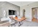 Spacious home office with modern decor, wood accent wall, and ample natural light for a comfortable workspace at 16959 Sandhurst Pl, Westfield, IN 46074