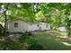 Landscaped backyard featuring lush greenery and a cozy seating area at 1740 Haynes Ave, Indianapolis, IN 46240