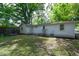 Backyard featuring a well-maintained lawn and cozy patio seating area at 1740 Haynes Ave, Indianapolis, IN 46240