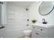 Stylish bathroom with a shower-tub combo, framed mirror, and modern fixtures at 1740 Haynes Ave, Indianapolis, IN 46240