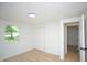 This is a bright bedroom featuring a closet and light wood flooring at 1740 Haynes Ave, Indianapolis, IN 46240