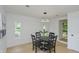 Bright dining room featuring a round table with black chairs and modern lighting at 1740 Haynes Ave, Indianapolis, IN 46240