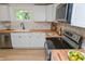 Bright kitchen featuring white cabinets, wood countertops, stainless steel appliances, and a window view at 1740 Haynes Ave, Indianapolis, IN 46240