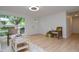 Bright living room with light wood floors, neutral furniture, and a seamless flow to the front entrance at 1740 Haynes Ave, Indianapolis, IN 46240