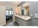 Gray bathroom featuring a double sink vanity, large mirror, and modern lighting at 2186 Chick Evans Way, Westfield, IN 46074