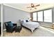Cozy bedroom with a ceiling fan, large windows and a leather chair at 2186 Chick Evans Way, Westfield, IN 46074