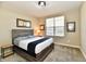 Comfortable bedroom with neutral walls, carpet, and natural light streaming through window at 2186 Chick Evans Way, Westfield, IN 46074