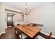 Spacious dining room with hardwood floors and view into the living area at 2186 Chick Evans Way, Westfield, IN 46074