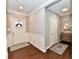 Elegant entryway featuring wainscoting, hardwood floors, and a decorative rug, leading to other rooms at 2186 Chick Evans Way, Westfield, IN 46074