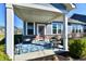 Covered front porch with seating area perfect for enjoying the outdoors at 2186 Chick Evans Way, Westfield, IN 46074