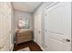 Hallway featuring hardwood floors, neutral paint, decorative artwork and doors to additional rooms at 2186 Chick Evans Way, Westfield, IN 46074