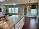 Open concept kitchen boasting sleek countertops, pendant lighting, and abundant natural light at 2186 Chick Evans Way, Westfield, IN 46074