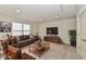 Comfortable living room with brown leather seating and a large TV at 2186 Chick Evans Way, Westfield, IN 46074