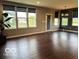 Bright living room featuring sleek hard floors, large windows, and modern roller shades at 2186 Chick Evans Way, Westfield, IN 46074