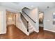 Elegant staircase featuring a dark wood handrail and iron balusters at 2186 Chick Evans Way, Westfield, IN 46074