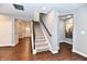 Well-lit staircase with carpeted steps and a wooden handrail at 2186 Chick Evans Way, Westfield, IN 46074