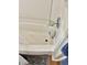 Clean bathtub with updated fixtures and white tile surround in bathroom at 2308 W Surrey Dr, Muncie, IN 47304