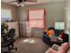 Inviting bedroom showcasing a desk and comfortable chair, perfect for a home office at 2308 W Surrey Dr, Muncie, IN 47304