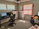 Comfortable bedroom featuring a desk with computer and comfortable seating area at 2308 W Surrey Dr, Muncie, IN 47304