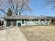 Charming ranch-style home featuring a cozy facade, attached garage, and well-maintained lawn at 2308 W Surrey Dr, Muncie, IN 47304