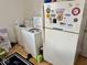 Laundry room featuring a refrigerator, washer, and dryer at 2308 W Surrey Dr, Muncie, IN 47304