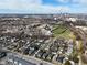 Aerial view of neighborhood homes with school, football field, and downtown skyline at 2528 S New Jersey St, Indianapolis, IN 46225