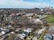Aerial view of neighborhood homes with school, football field, and downtown skyline at 2528 S New Jersey St, Indianapolis, IN 46225