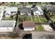 Aerial view of homes with fenced backyards and detached garages with driveways at 2528 S New Jersey St, Indianapolis, IN 46225