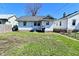 A fenced backyard has green grass and a small patio area at 2528 S New Jersey St, Indianapolis, IN 46225