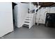 Basement staircase and laundry area with modern washer/dryer, providing convenience and functionality at 2528 S New Jersey St, Indianapolis, IN 46225