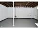 Unfinished basement with exposed beams, white painted concrete walls, and grey floor at 2528 S New Jersey St, Indianapolis, IN 46225