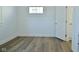 Cozy bedroom with wood floors, a window for natural light, and closet for functionality at 2528 S New Jersey St, Indianapolis, IN 46225