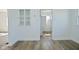 Dining room with fresh paint, wood-look floors and sunny windows at 2528 S New Jersey St, Indianapolis, IN 46225