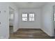 Dining room with fresh paint, wood-look floors and sunny windows at 2528 S New Jersey St, Indianapolis, IN 46225