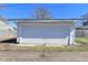 The detached one-car garage is white with a white garage door at 2528 S New Jersey St, Indianapolis, IN 46225