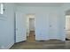 Hallway features hardwood floors and access to a brightly lit bathroom at 2528 S New Jersey St, Indianapolis, IN 46225