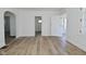 Living room with fresh paint, wood-look floors and doorways to other rooms at 2528 S New Jersey St, Indianapolis, IN 46225