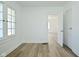 Bright living room featuring hardwood floors, neutral color scheme, and natural light streaming through multiple windows at 2528 S New Jersey St, Indianapolis, IN 46225