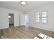 Bright living room with wood-look floors, fresh paint and sun-filled windows at 2528 S New Jersey St, Indianapolis, IN 46225