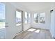 Bright sun room featuring many windows, light colored walls and modern floors at 2528 S New Jersey St, Indianapolis, IN 46225