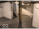 Basement showcasing painted walls, open layout, and exposed beams at 302 S Randolph St, Indianapolis, IN 46201