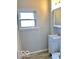 Well-lit bathroom showcasing a modern vanity and a bright window at 302 S Randolph St, Indianapolis, IN 46201