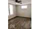 Well-lit bedroom with durable flooring and a ceiling fan for added comfort at 302 S Randolph St, Indianapolis, IN 46201
