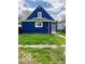 Exterior of the home features a modern blue finish with green grass at 302 S Randolph St, Indianapolis, IN 46201