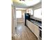 Modern kitchen featuring sleek countertops, contemporary cabinetry, stainless steel appliances, and durable flooring at 302 S Randolph St, Indianapolis, IN 46201