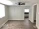 Inviting living room showcases updated floors and neutral walls, with an open doorway to the kitchen at 302 S Randolph St, Indianapolis, IN 46201