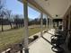 Relaxing back porch overlooking a vast yard with mature trees at 3040 Old Morgantown Rd, Martinsville, IN 46151