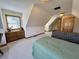 Bedroom featuring sloping ceilings, two beds, a dresser, and windows with natural lighting at 3040 Old Morgantown Rd, Martinsville, IN 46151