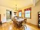 Cozy dining room with hardwood floors, chandelier, and views to the outside at 3040 Old Morgantown Rd, Martinsville, IN 46151